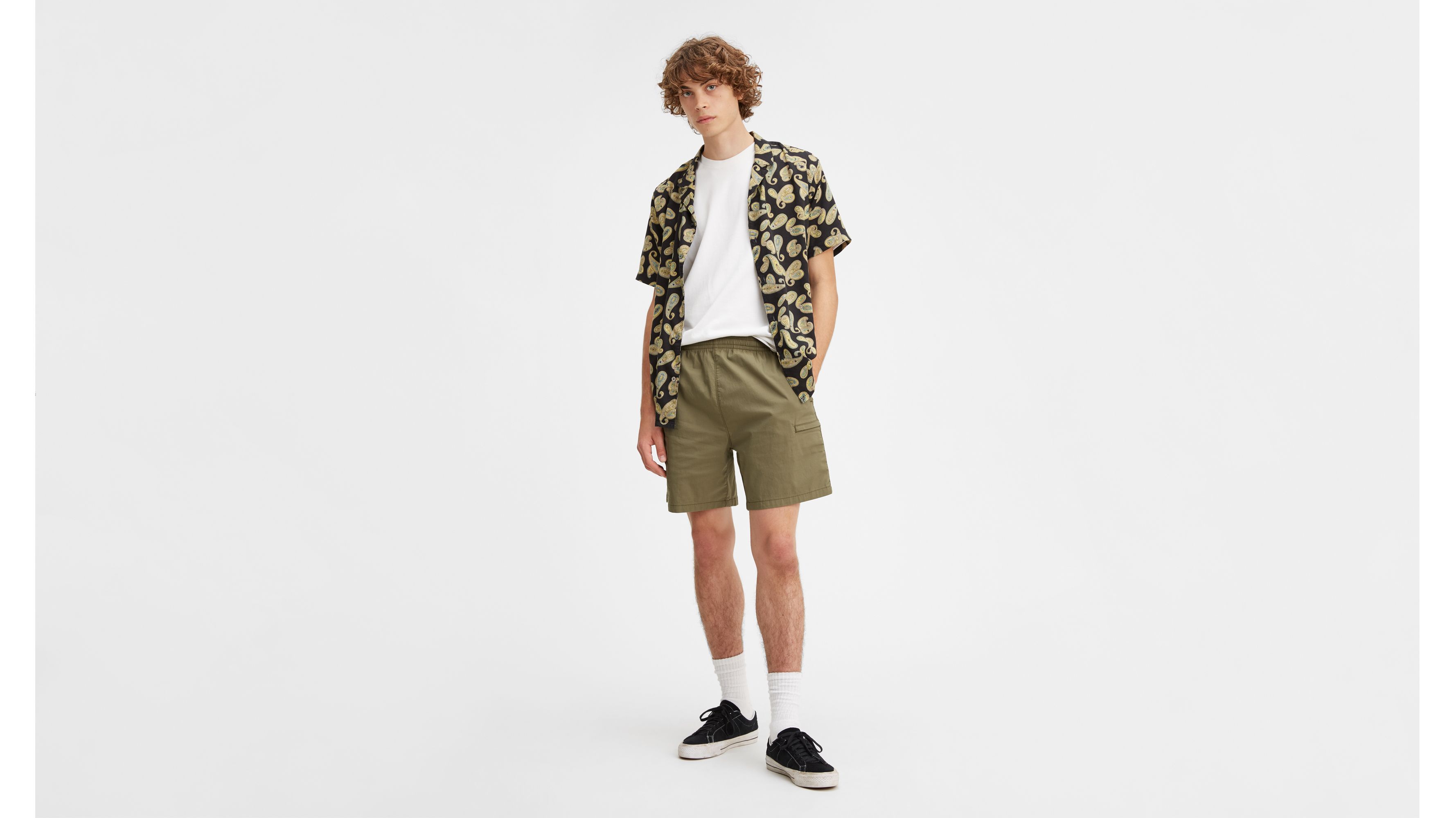 green levi shorts