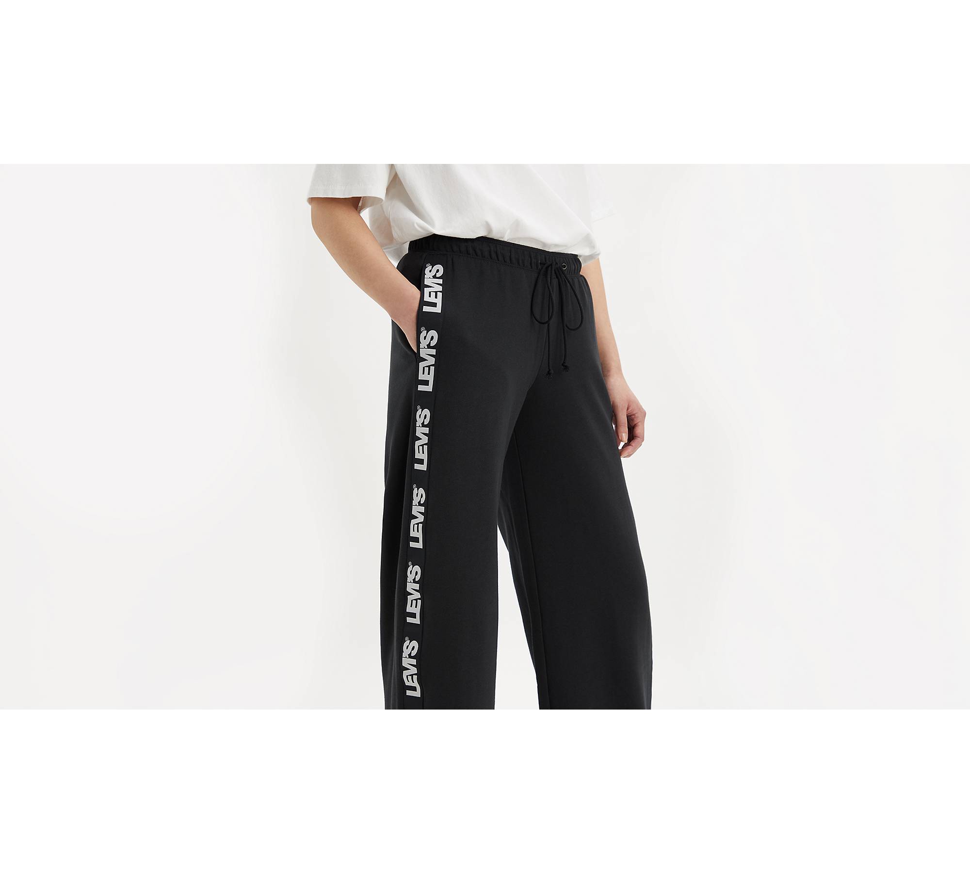 ASOS DESIGN low rise sweatpants with logo in black - ShopStyle Pants