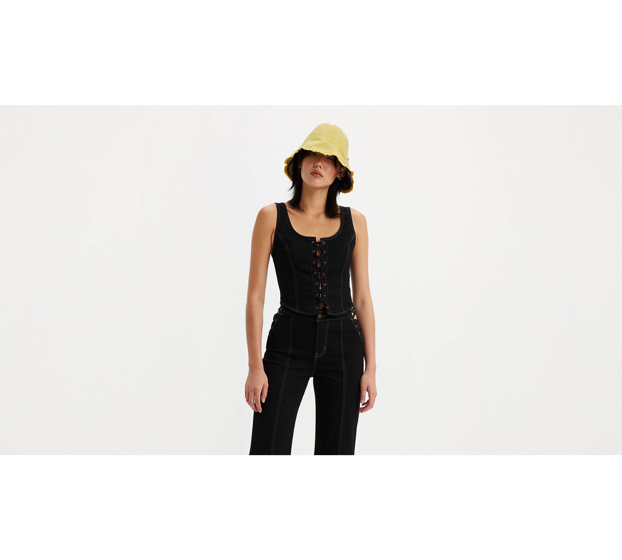 Premium AI Image  Barbie in Laceup corset top with a floppy hat and ankle  boots Generative AI